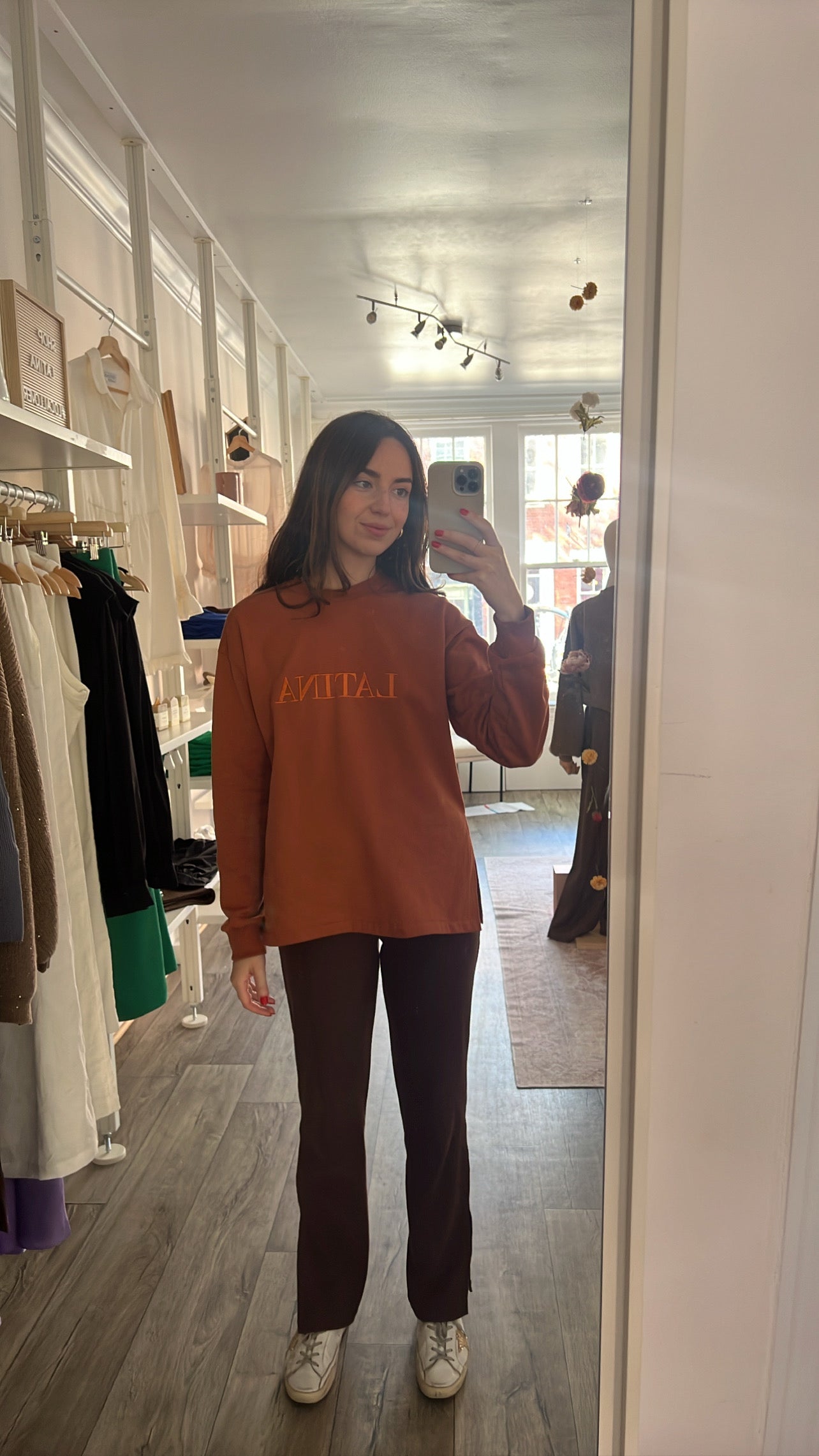 Handmade Sweater with fleece interior. Slits on the side for easy styling. Embroidered LATINA words on the front center
